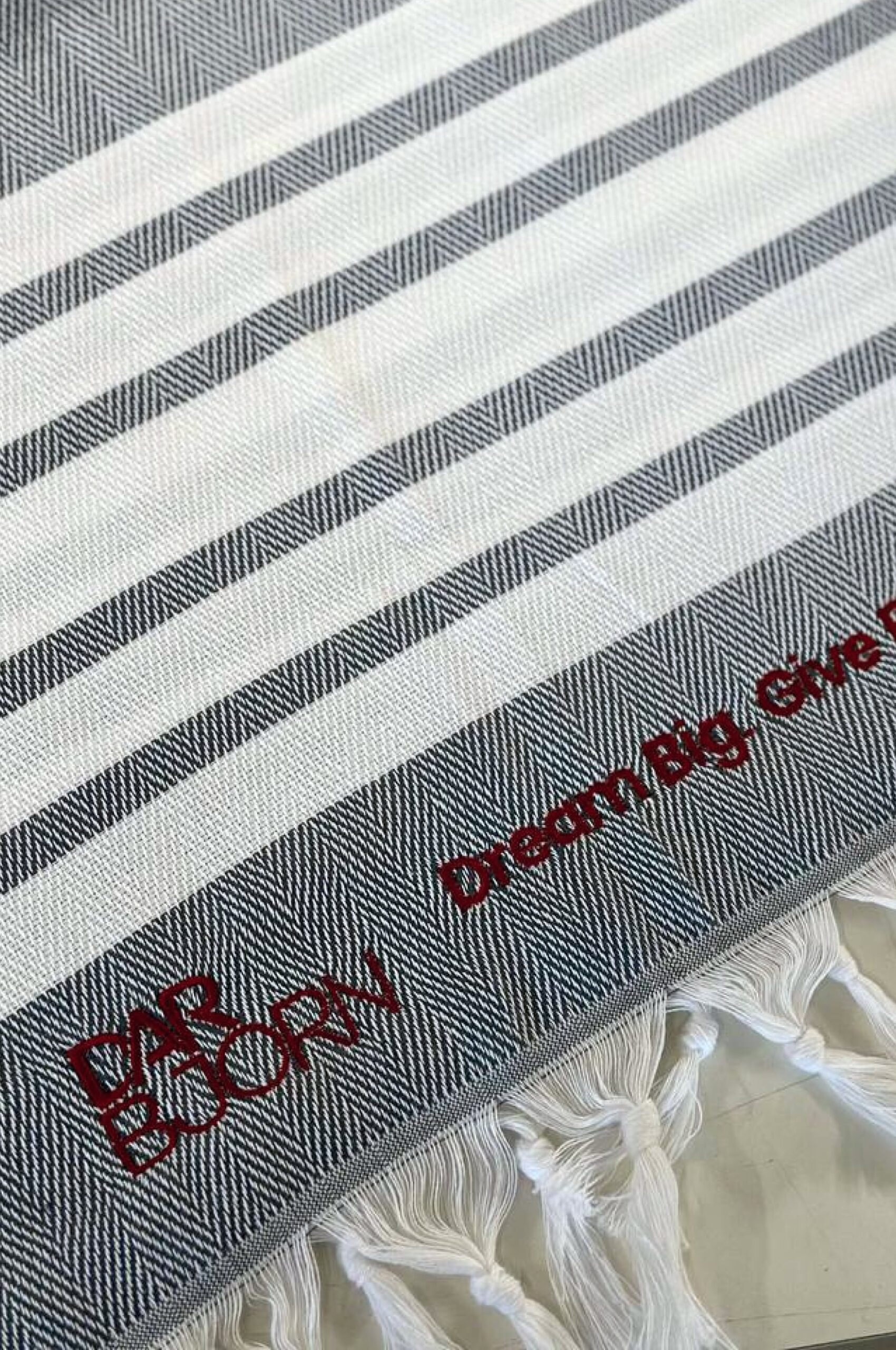 The cotton towel with fringes and custom embroidery