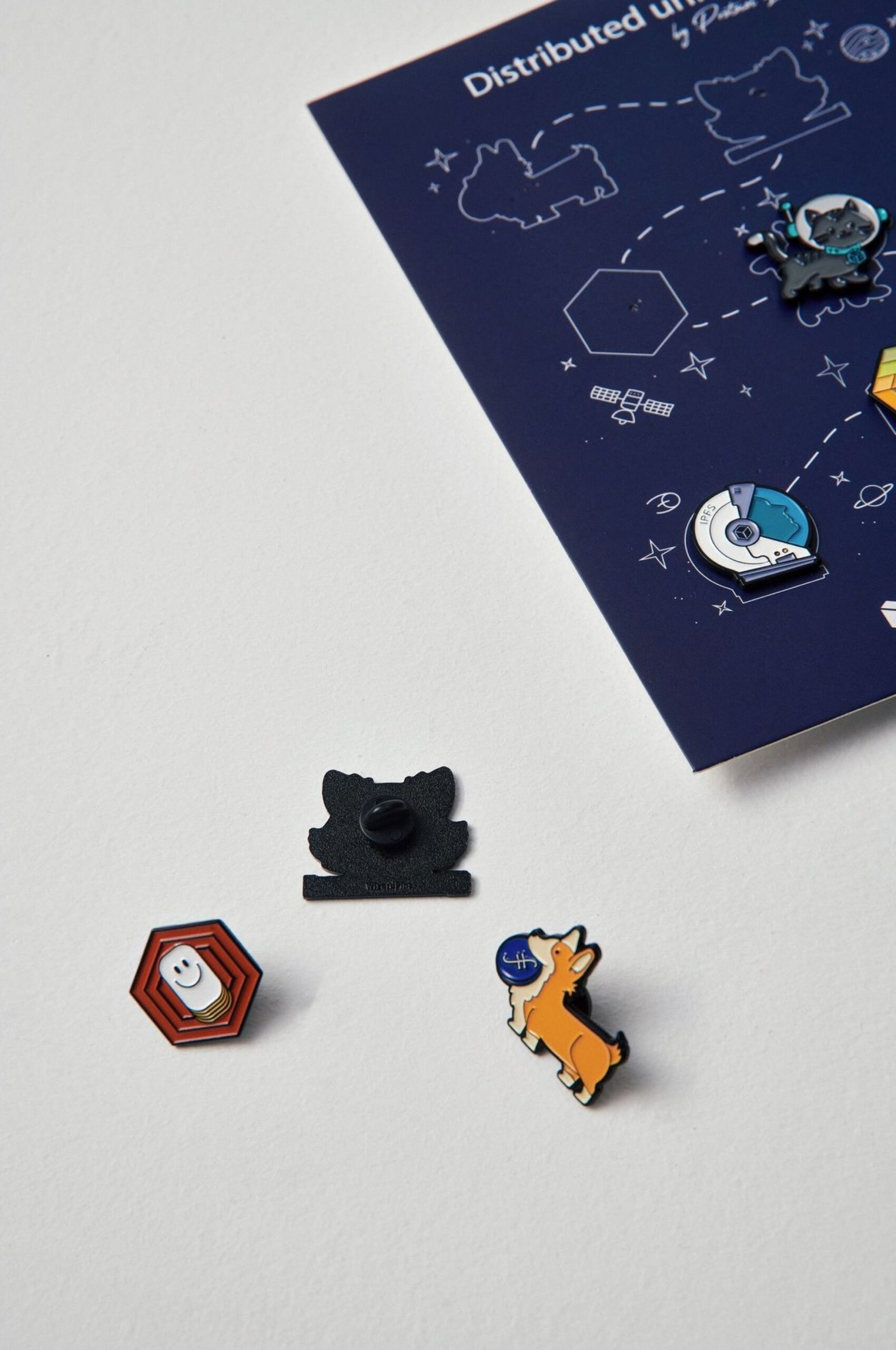 Gift cards with custom lapel pins.