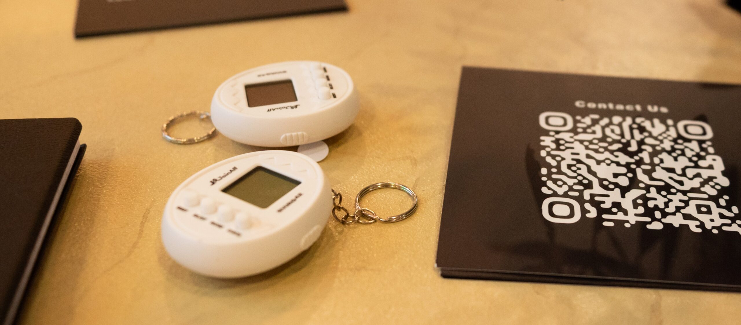 Customized Tamagotchi with company logo for custom event merchandise