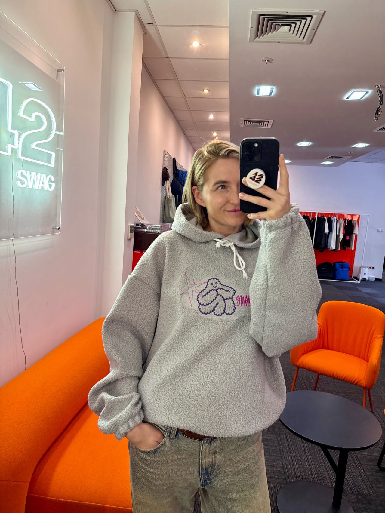 Sandra Bondare, co-founder of Swag42, wearing the Teddy Hoodie