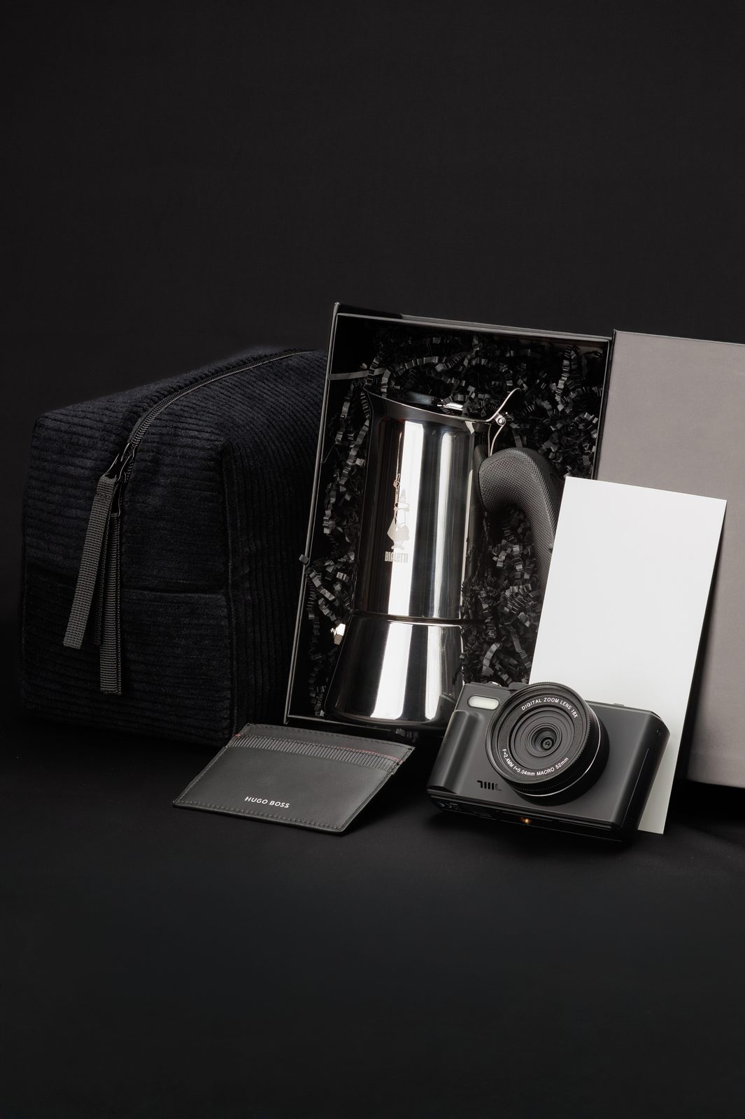 Premium corporate gift set with a Bialetti moka pot, a HUGO BOSS card holder and a camera