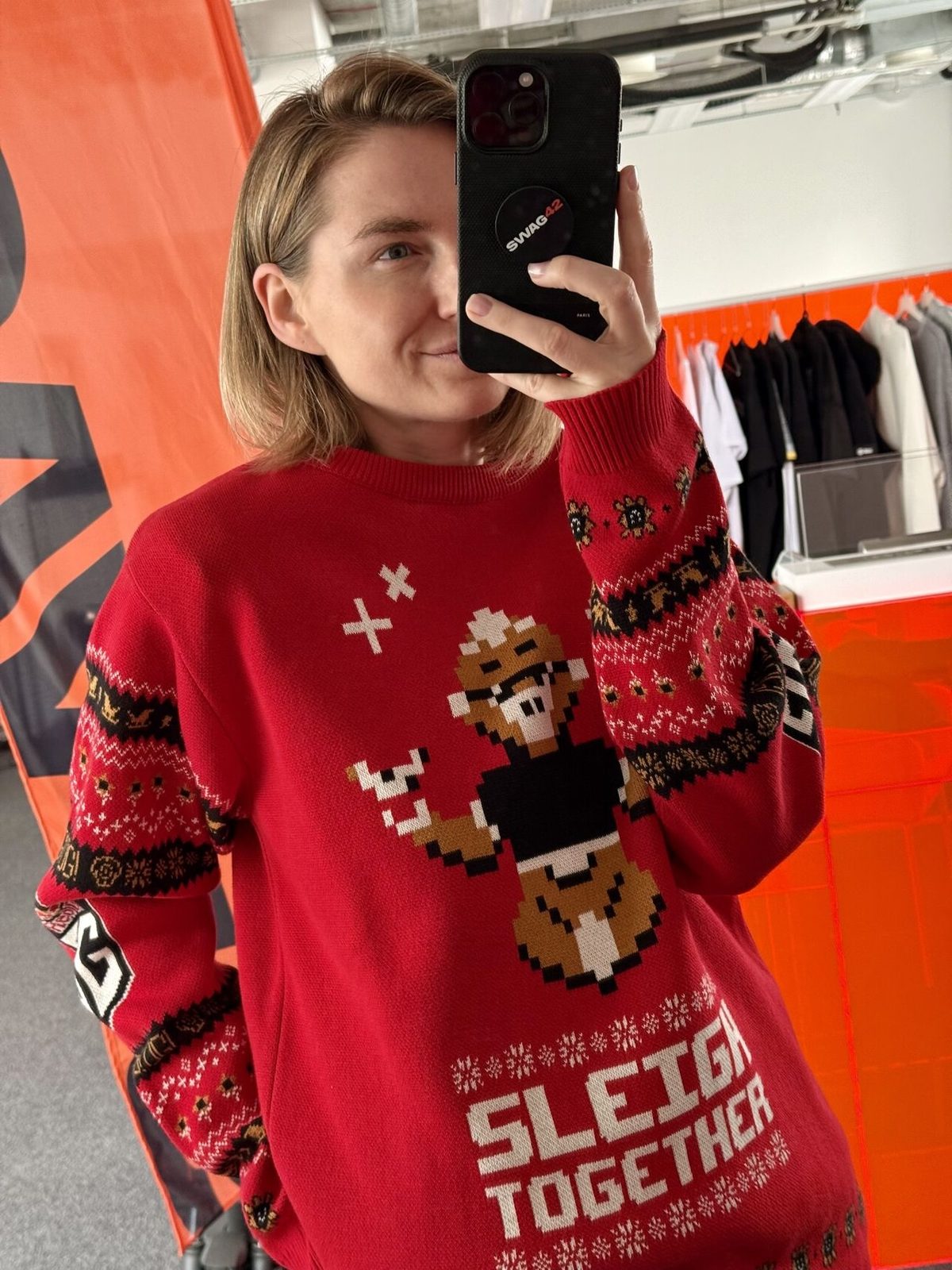 Sandra Bondare, co-founder of Swag42, in the Sleigh Together holiday sweater
