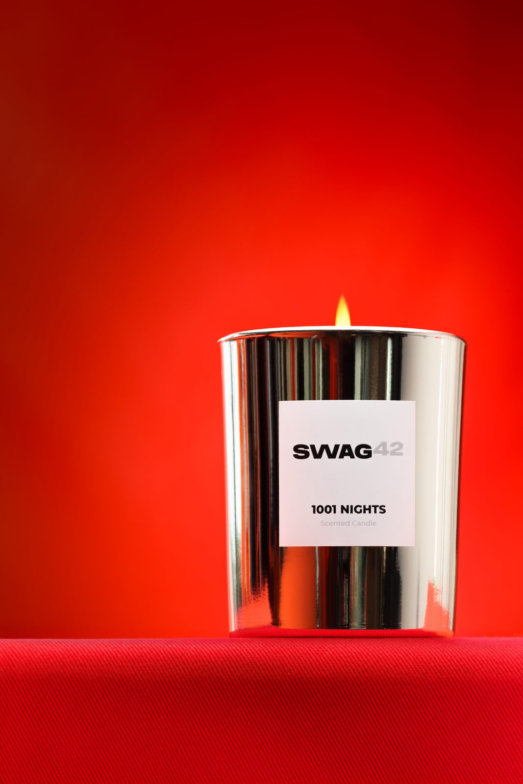 Swag42 scented candle on a red background