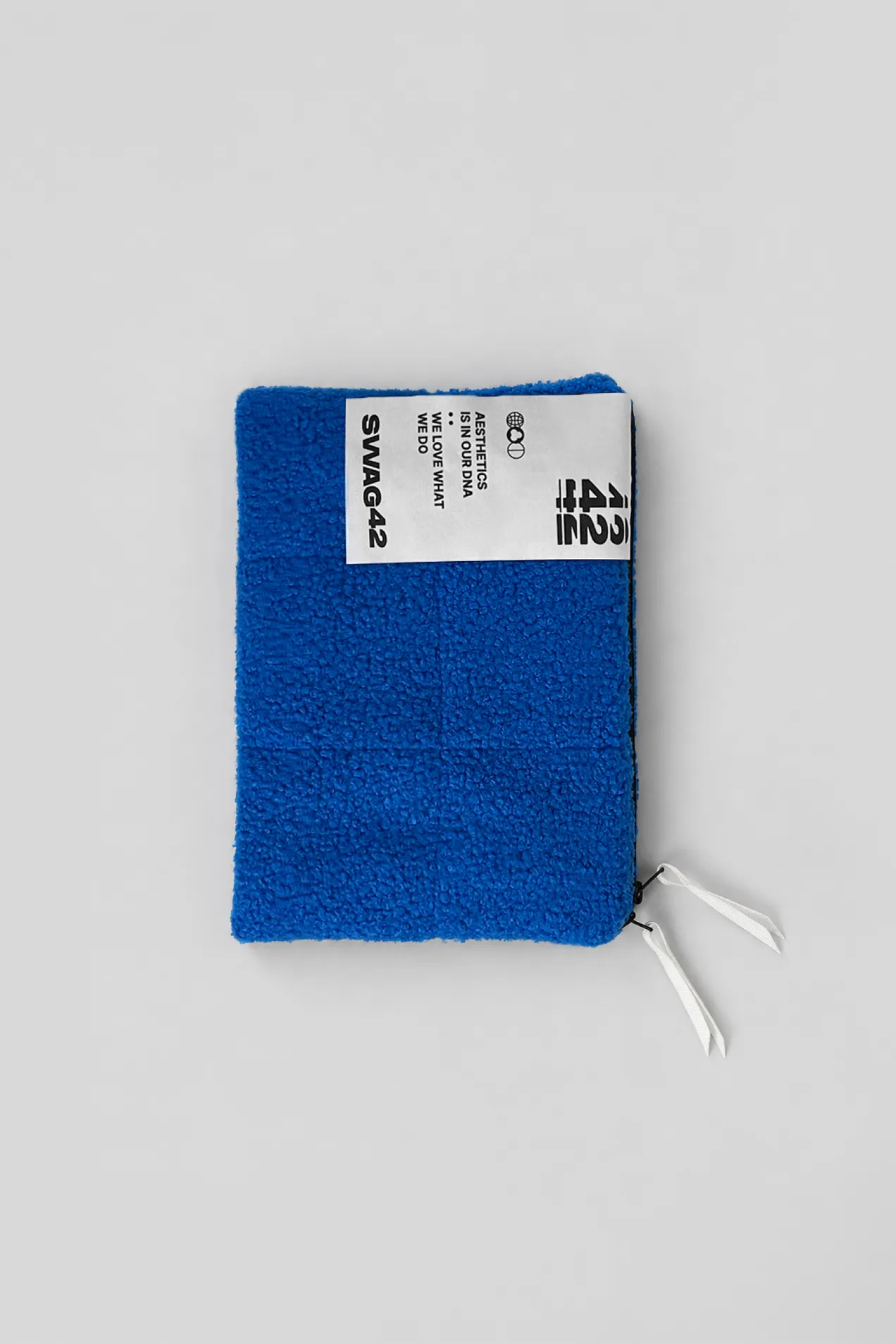 Teddy laptop sleeve with a brand label by Swag42